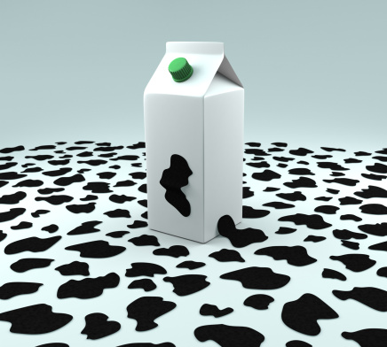 A carton of milk with cow pattern