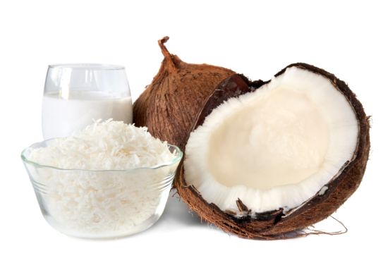 Fresh coconut, shredded coconut, and coconut cream, isolated on white.