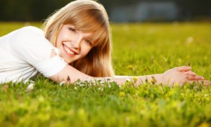 happy-woman-in-grass-660x400