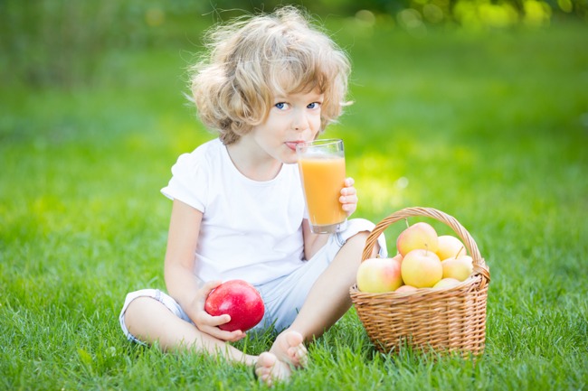 Child drinking apple juice