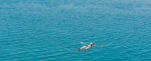 one woman swimming bathing in Dead Sea Jordan