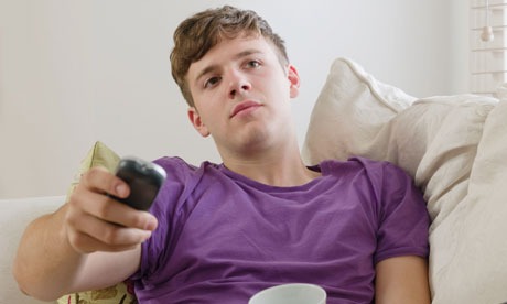 Young man watching tv - online video tv advertising