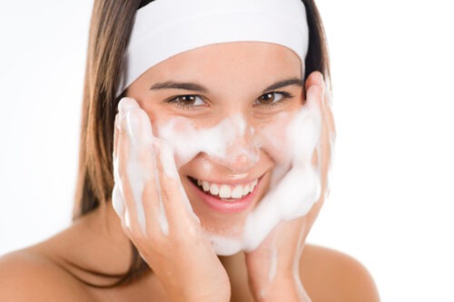 Teenager problem skin care - woman wash face