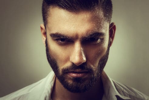 Portrait of a man with a beard and wet face