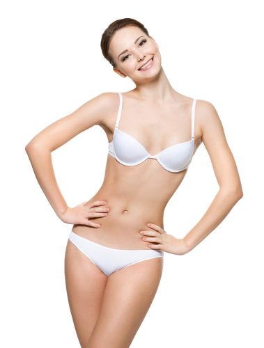 Happy young woman with beautiful female body in white underwear -  isolated on white background