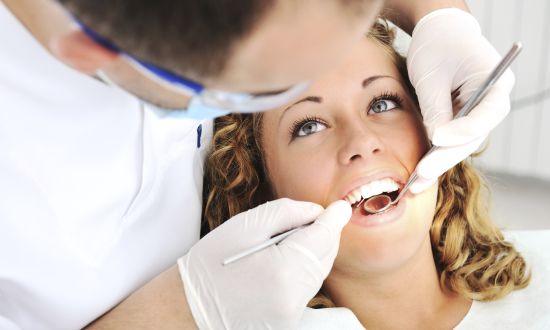 Dentist's teeth checkup with young female, series of related photos