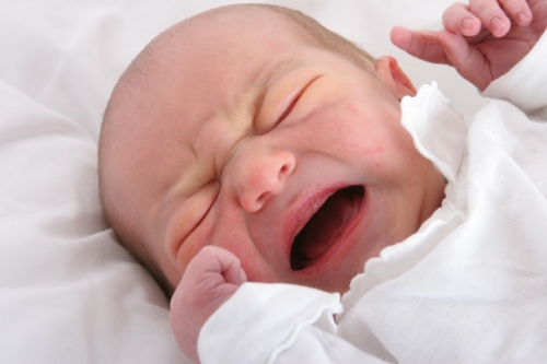 one day old newborn baby crying