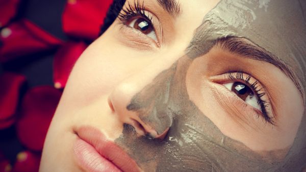young-woman-face-half-with-clay-mask