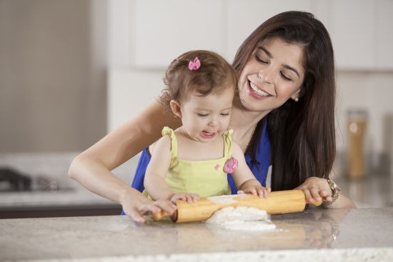 Helping mom cook dinner