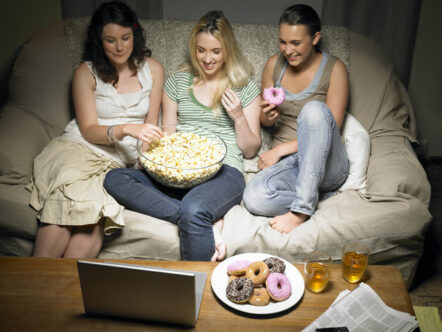 Three Young Women Watching Movie --- Image by © Frank and Helena/cultura/Corbis