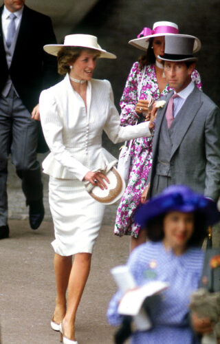 The Prince and Princess of Wales in the royal enclosure at Royal Ascot, June 1986. Princess Diana wears a cream peplum jacket and somerville hat. (Photo by Jayne Fincher/Getty Images)