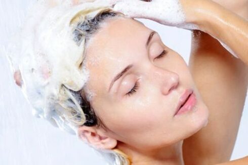 Beautiful woman washing head